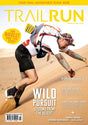 Trail Run magazine cover featuring a mountain biker leaning forward on a sandy dune, with large yellow 'TRAIL RUN' title at the top and cover text including 'WILD PURSUIT' and 'LESSONS FROM THE DESERT'. - Trail Run Magazine - Edition 60 / 2026