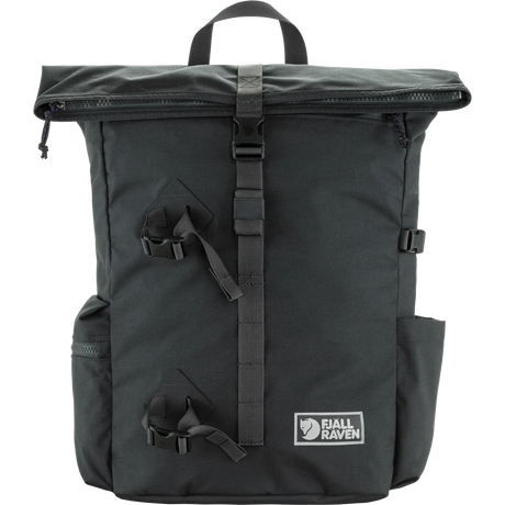 A dark gray Jell Raven backpack with a top handle, roll-top zipper, and multiple black straps and buckles, shown against a plain white background. - Fjällräven Vardag Foldsack 25 - Coal Black