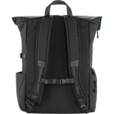 The back view of a black roll-top backpack, showing the padded shoulder straps, central back panel, side pockets, and top carry handle against a solid white background. - Fjällräven Vardag Foldsack 25 - Coal Black