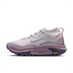 A Nike ACG ZEGAMA ZOOMX trail running shoe in a light lavender and purple colorway, featuring a textured mesh upper, a purple Swoosh, and a purple Vibram outsole, shown from a side profile on a light gray background.
