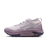 A Nike ACG ZEGAMA ZOOMX trail running shoe in a light lavender and purple colorway, featuring a textured mesh upper, a purple Swoosh, and a purple Vibram outsole, shown from a side profile on a light gray background.