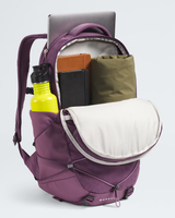 A purple DOREKAL backpack shown open, filled with a laptop, books, a green pouch, and a bright yellow water bottle, on a light gray background. - The North Face Borealis Backpack (Women's) - Chroma Purple Light Heather/Hushed Lavender