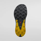 Close-up of a shoe sole with yellow and black tread pattern on a gray background - La Sportiva Prodigio Max Shoes (Men's) - Black/Yellow