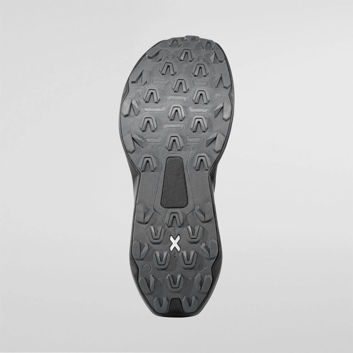 The outsole of a black athletic shoe, showing deep tread patterns and a small white stylized 'X' logo near the heel, photographed against a light gray background. - La Sportiva Prodigio 2 GORE-TEX Shoes (Men's) - Black/Reflective