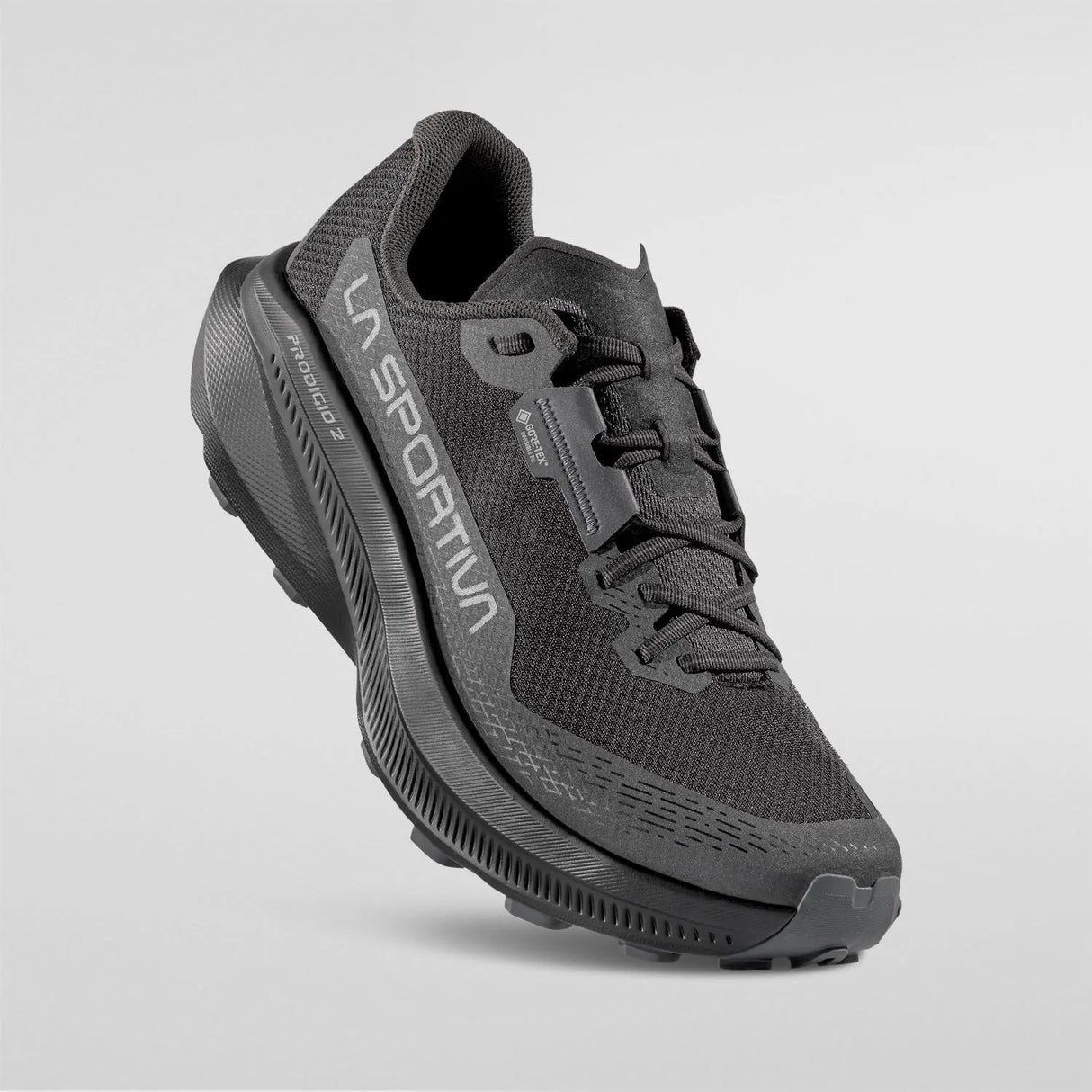 A dark gray and black La Sportiva trail running shoe floating against a light gray background. - La Sportiva Prodigio 2 GORE-TEX Shoes (Men's) - Black/Reflective