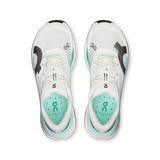 A pair of On Cloudrunner 300 running shoes shown from a top-down view, featuring a white mesh upper with mint green accents, black and white textured side panels, and a white midsole with a translucent heel. - On Cloudultra Pro Shoes (Women's) - Ivory/Celeste