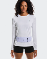 Woman wearing a light gray long-sleeve top with a matching waist bag on a white background - On Speed Belt (Unisex) - Thistle