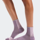 Purple socks worn by a person on a white background - On Performance Run Sock Mid (Unisex) - Dewberry/Sakura