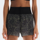 Black athletic shorts with gold star pattern worn by a person on a white background - On Ultra Shorts (Women's) - Iron/Lime