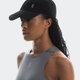 Woman wearing a black cap and gray tank top on a white background - On Lightweight Cap - Black