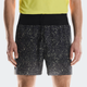 Person wearing black shorts with white speckle pattern and a yellow top on a light gray background - On Ultra Shorts (Men's) - Iron/Lime