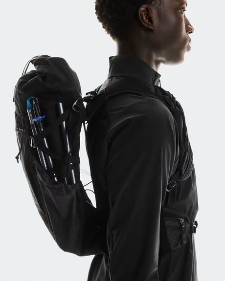 Person wearing a black backpack with visible equipment on a white background - On Trail Pack 20L - Black