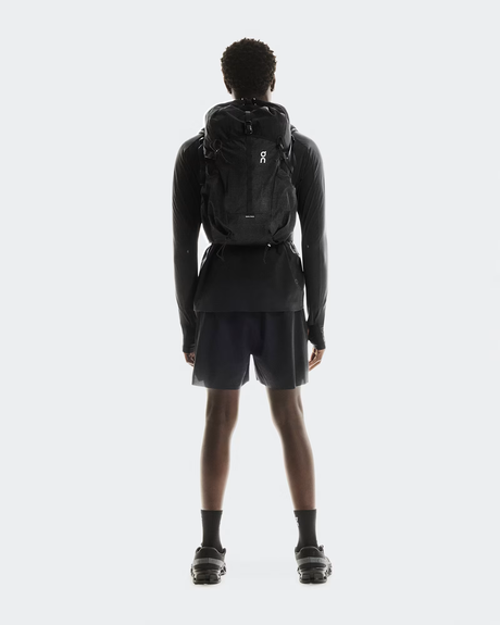 Person wearing a black backpack on a white background - On Trail Pack 20L - Black