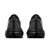 A pair of black and dark gray athletic sneakers shown from the rear, featuring chunky black midsoles and heel pull tabs with the 'On' logo, on a plain white background. - On Cloudsoma Shoes (Women's) - Black/black