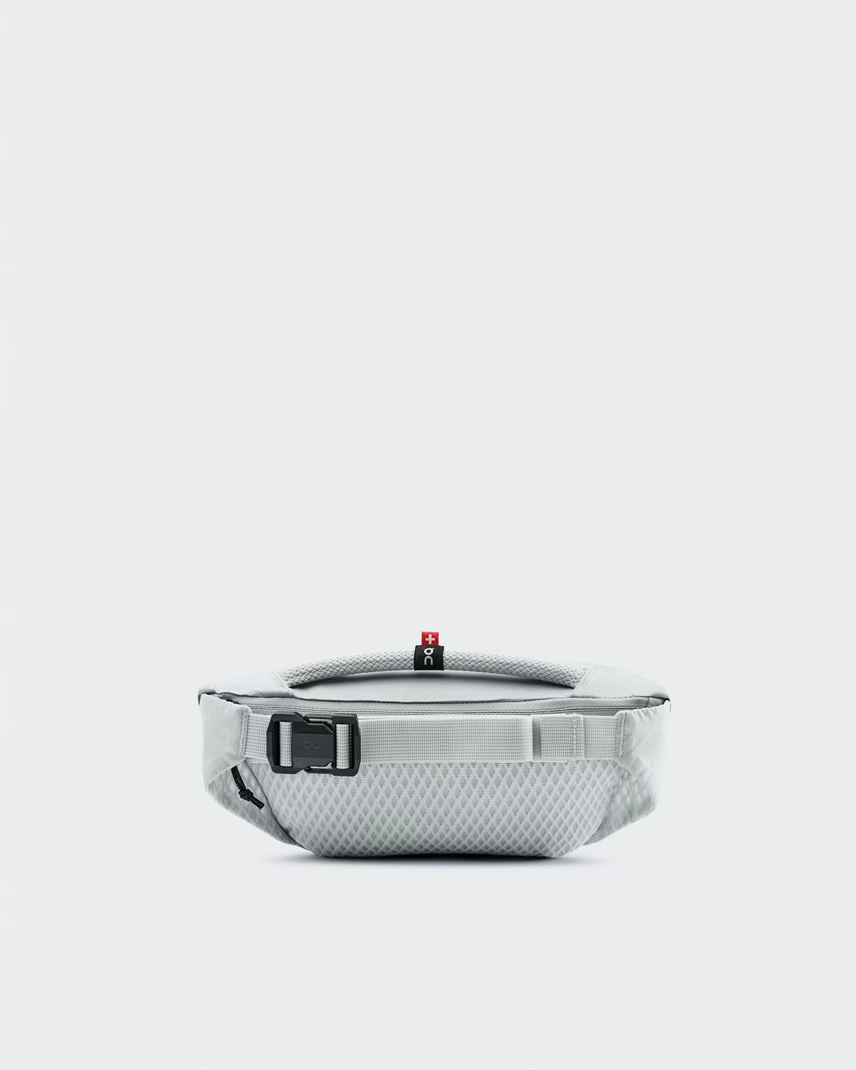 Open travel case with electronic device and cable on a white background - On Waist Pack 2L Lite - Glacier