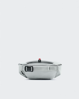 Open travel case with electronic device and cable on a white background - On Waist Pack 2L Lite - Glacier