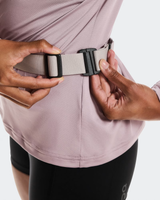 Person adjusting a belt with a neutral color on a plain background - On Speed Belt (Unisex) - Fog