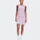 A woman modeling a light pink athletic set consisting of a sleeveless tank top and matching shorts, paired with white socks and white sneakers, against a solid light gray background. - On Performance Tank (Women's) - Foxglove/Orchid