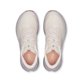 A top-down view of a pair of On Cloudrunning sneakers in a light cream and beige colorway, featuring a breathable mesh upper, white laces, and a soft pinkish-orange footbed visible inside the open toes. - On Cloudultra 3 Shoes (Women's) - Oyster/Ether