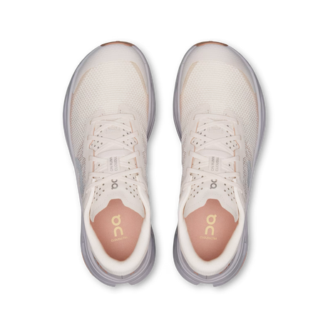 A pair of On Cloudrunner running shoes shown from a top-down view, featuring a cream and light gray mesh upper with a light pink inner lining and gold 'on' branding on the insole. - On Cloudultra 3 Shoes (Women's) - Oyster/Ether