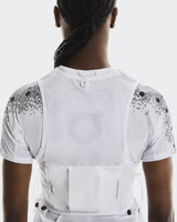 Person wearing a white athletic outfit with black patterned sleeves on a light gray background - On Ultra Vest Pro (Unisex) - White