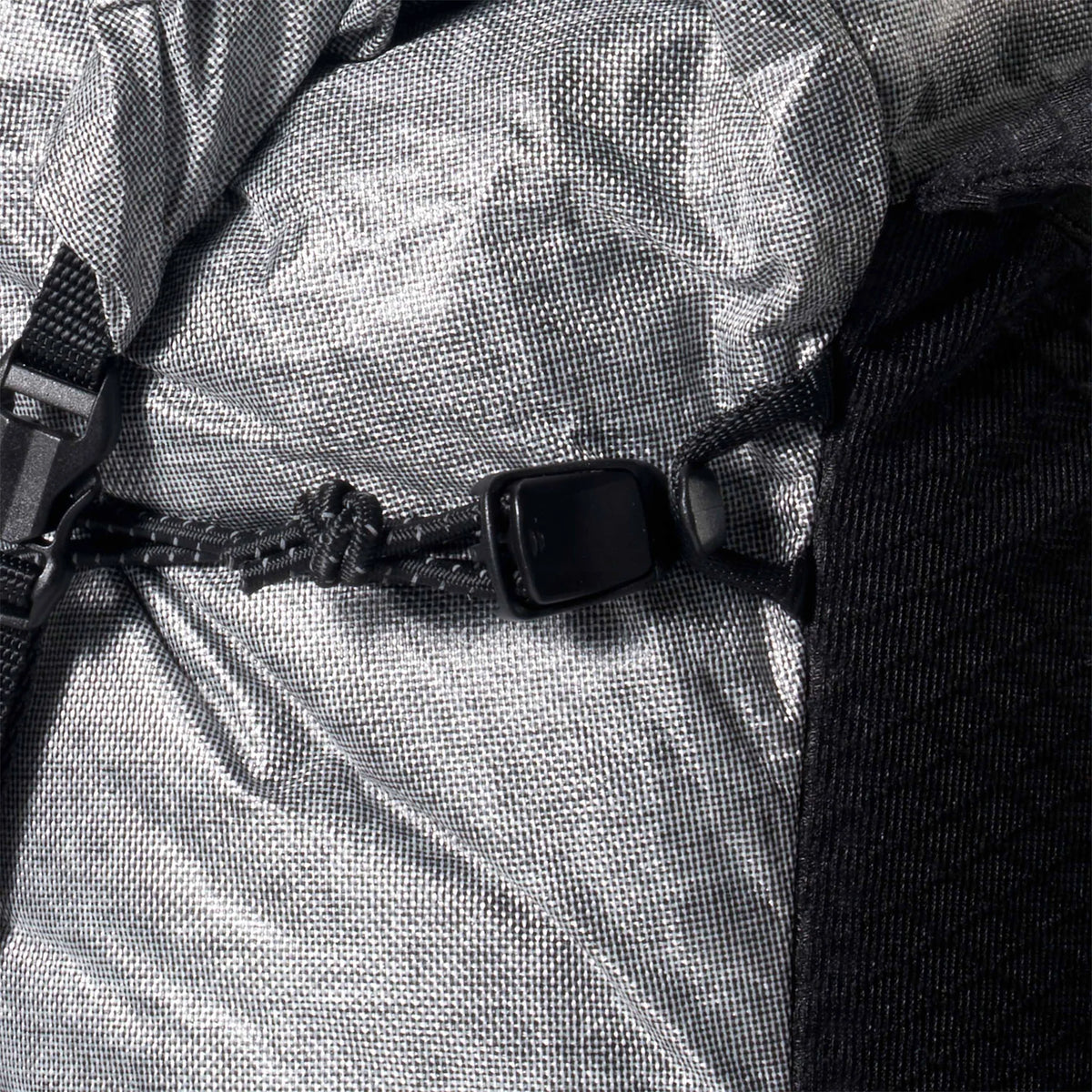 Close-up of a backpack with a focus on the straps and mesh back panel. - Hyperlite Mountain Gear Pemi 15 Backpack