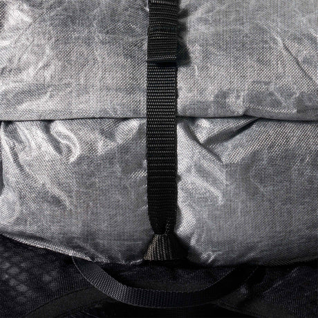 Close-up of a gray bag with a black strap - Hyperlite Mountain Gear Pemi 15 Backpack