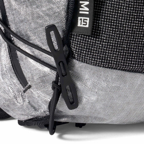 Close-up of a gray backpack with black straps and a brand logo on a white background - Hyperlite Mountain Gear Pemi 15 Backpack