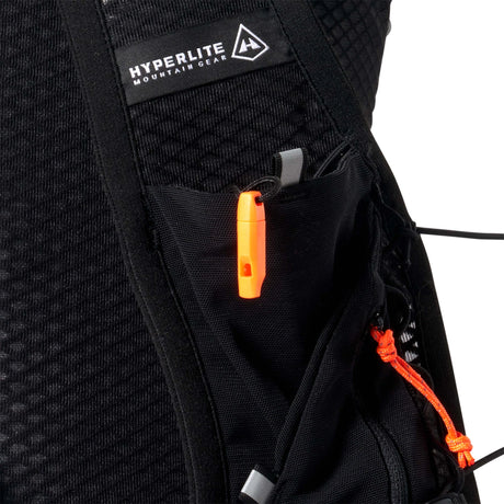 Close-up of a black backpack with orange accents and Hyperlite Mountain Gear logo. - Hyperlite Mountain Gear Pemi 15 Backpack