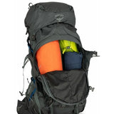 Osprey hiking backpack with colorful items inside on a white background - Osprey Aether Plus 70 Backpack (Men's) - Eclipse Grey