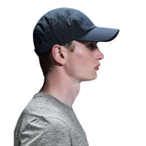 A man in profile wearing a dark gray athletic cap with a perforated pattern on the crown, paired with a heather gray t-shirt, against a solid white background. - On Lightweight Cap - Navy