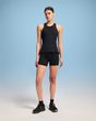 Person wearing a black tank top and shorts on a gradient background - On Performance Tank (Women's) - Black/Eclipse