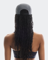 Person wearing a gray cap with a long black ponytail on a white background - On Lightweight Cap - Rock