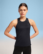 Woman wearing a black athletic tank top with a logo on a gradient background - On Performance Tank (Women's) -