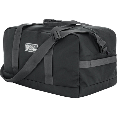 Black duffel bag with a visible brand logo on a white background - Fjällräven Vardag Duffel 33L - Black