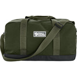 Green duffel bag with a visible brand logo on a white background - Fjällräven Vardag Duffel 33L - Deep Forest